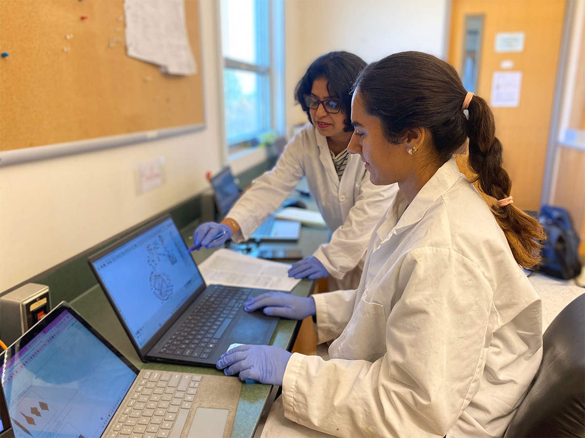 Vanessa and Dr. Venuogopal at a computer