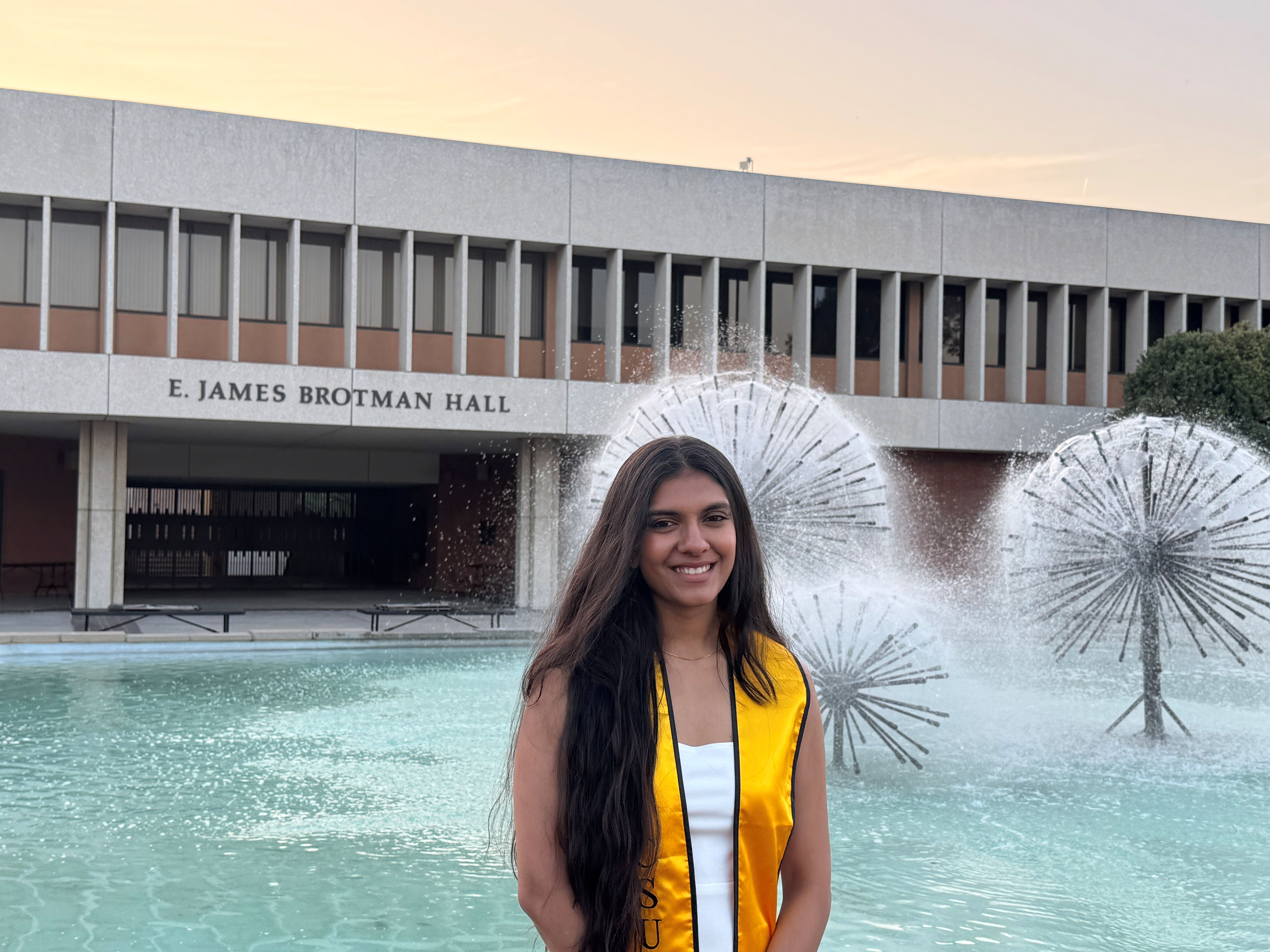 Heer Shah, posing in front of a fountain by Brotman Hall 