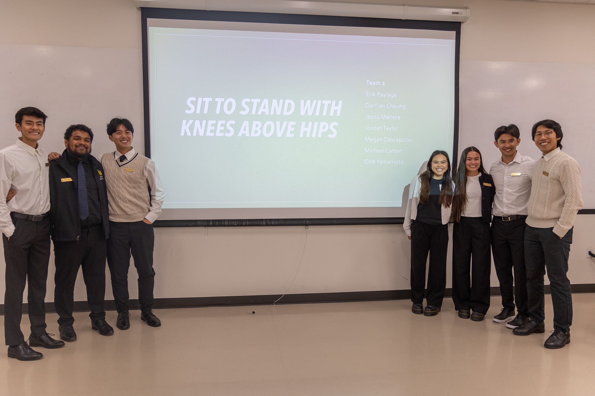 Movement analysis students pose with project