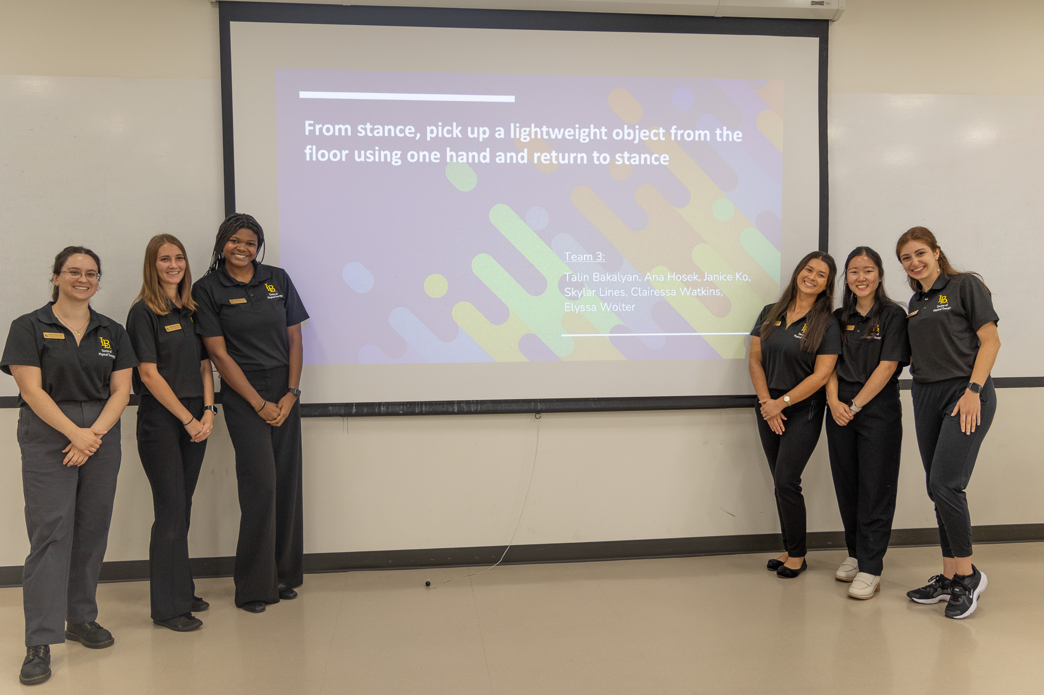 Movement analysis students pose with project