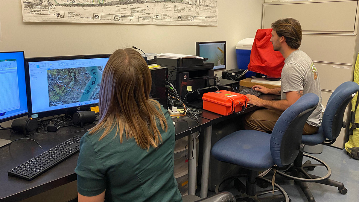 student researchers at computers