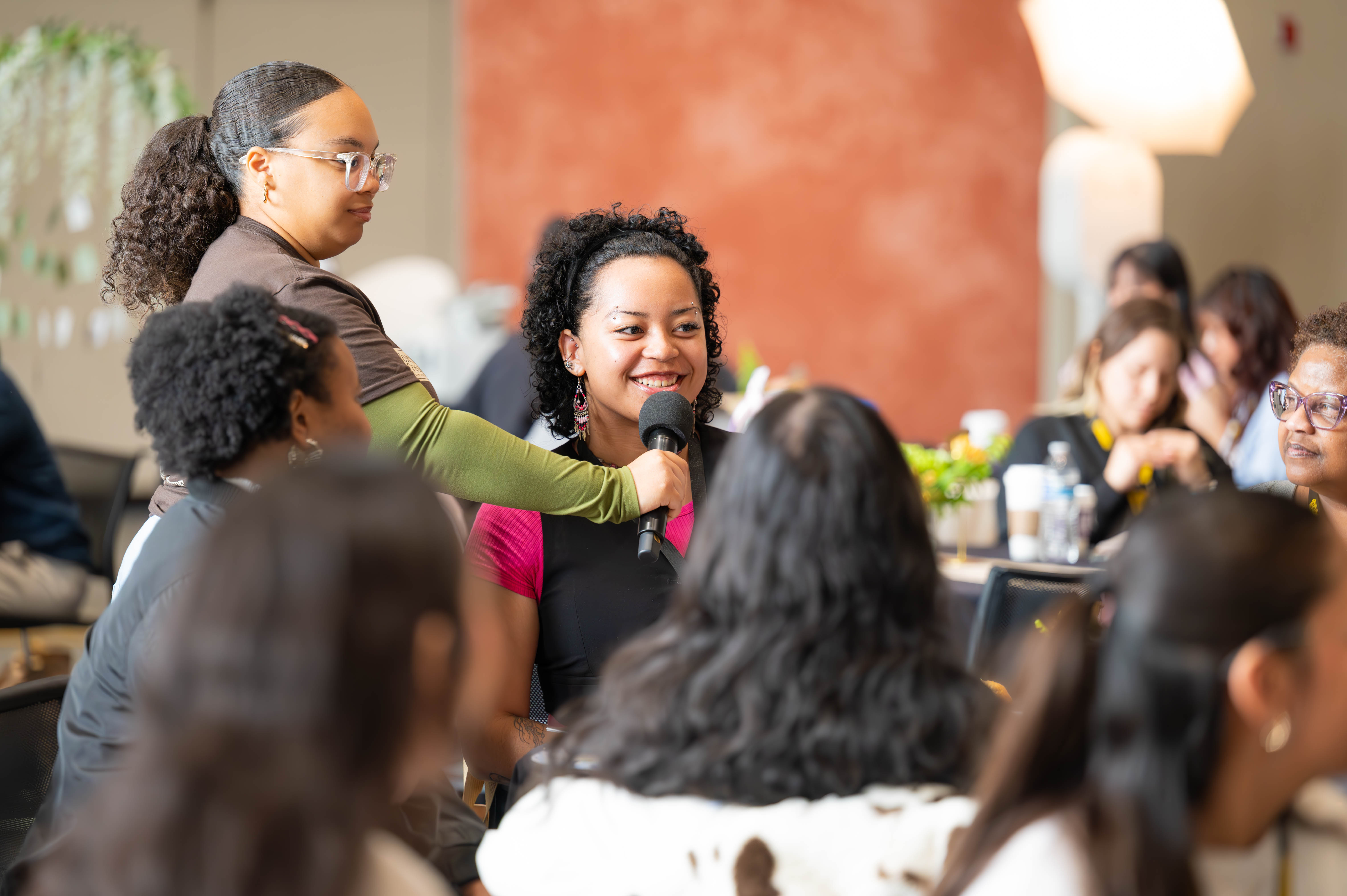 Attendees participating in conversation at the 2025 WOC Leadership Conference.