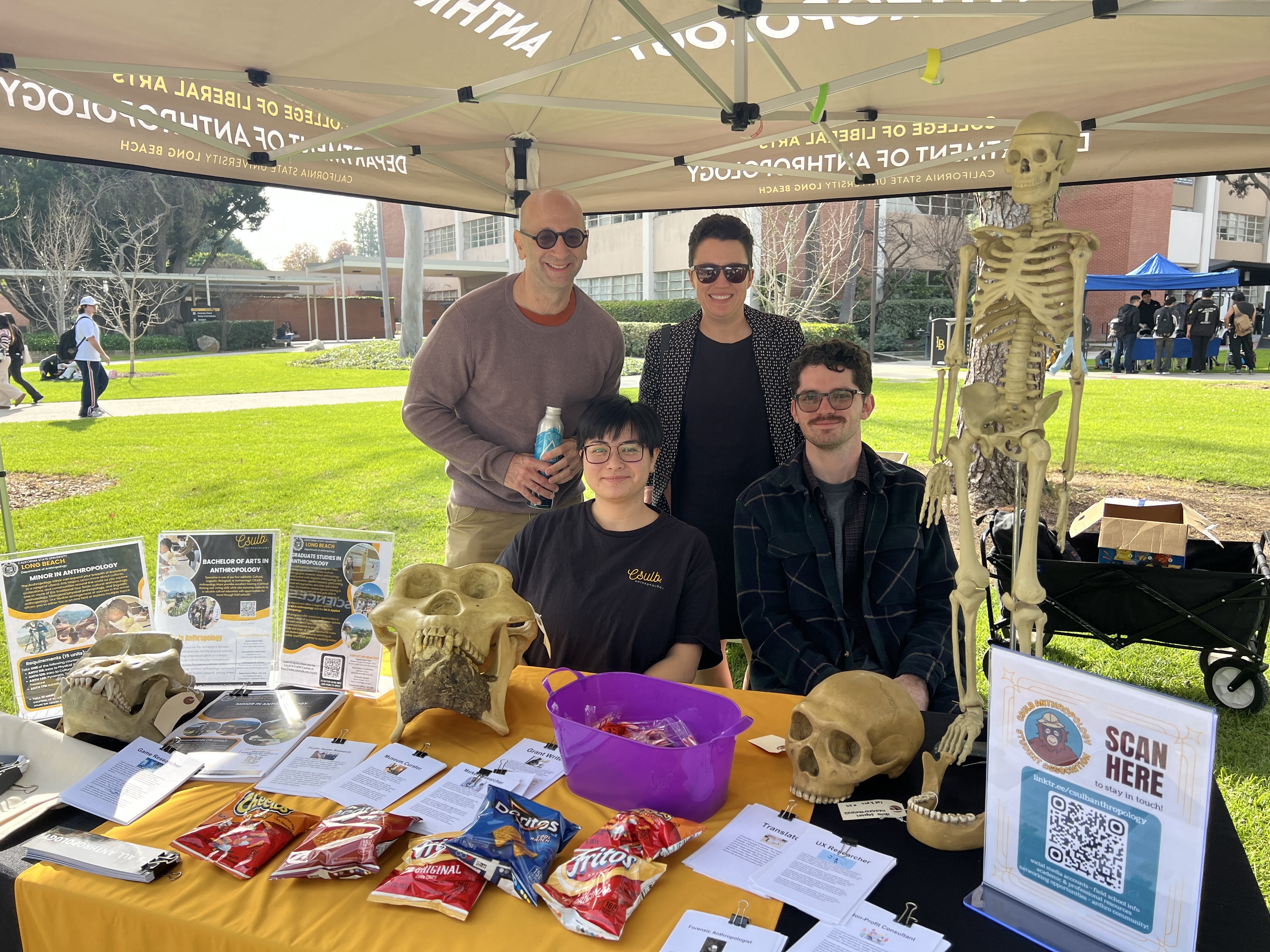 Anthropologist department members at a booth