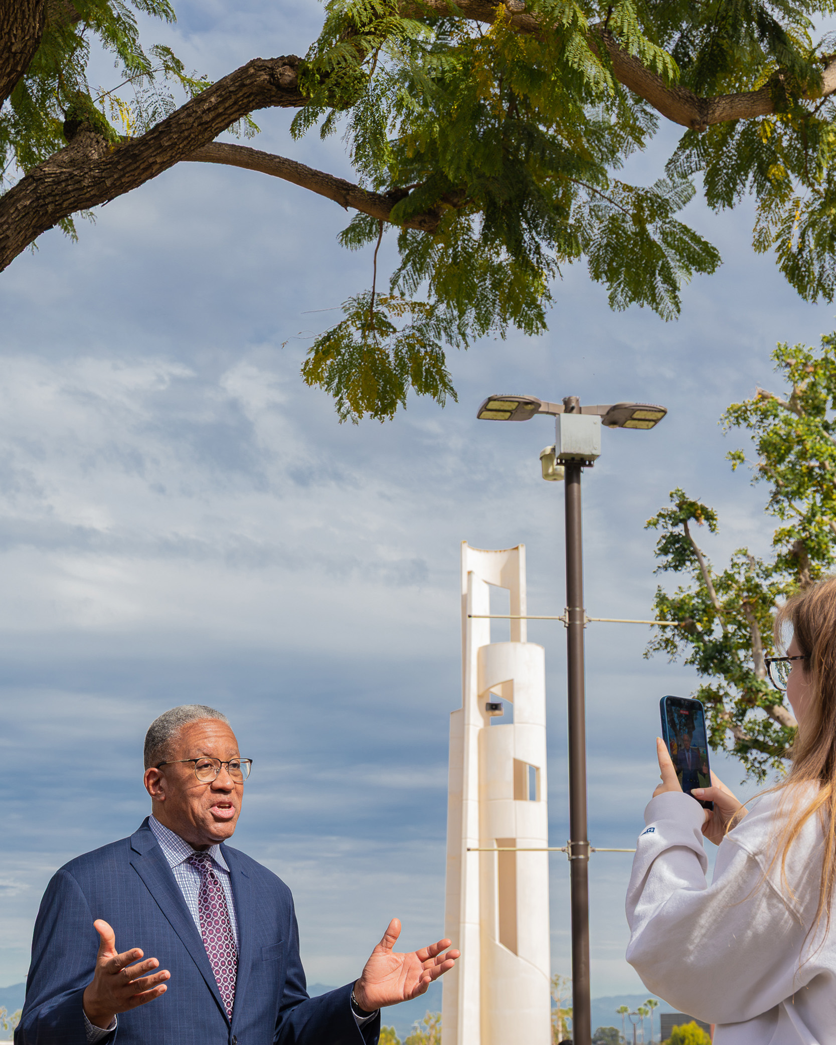 A student takes a photo of CSULB President-designate Loren J. Blanchard