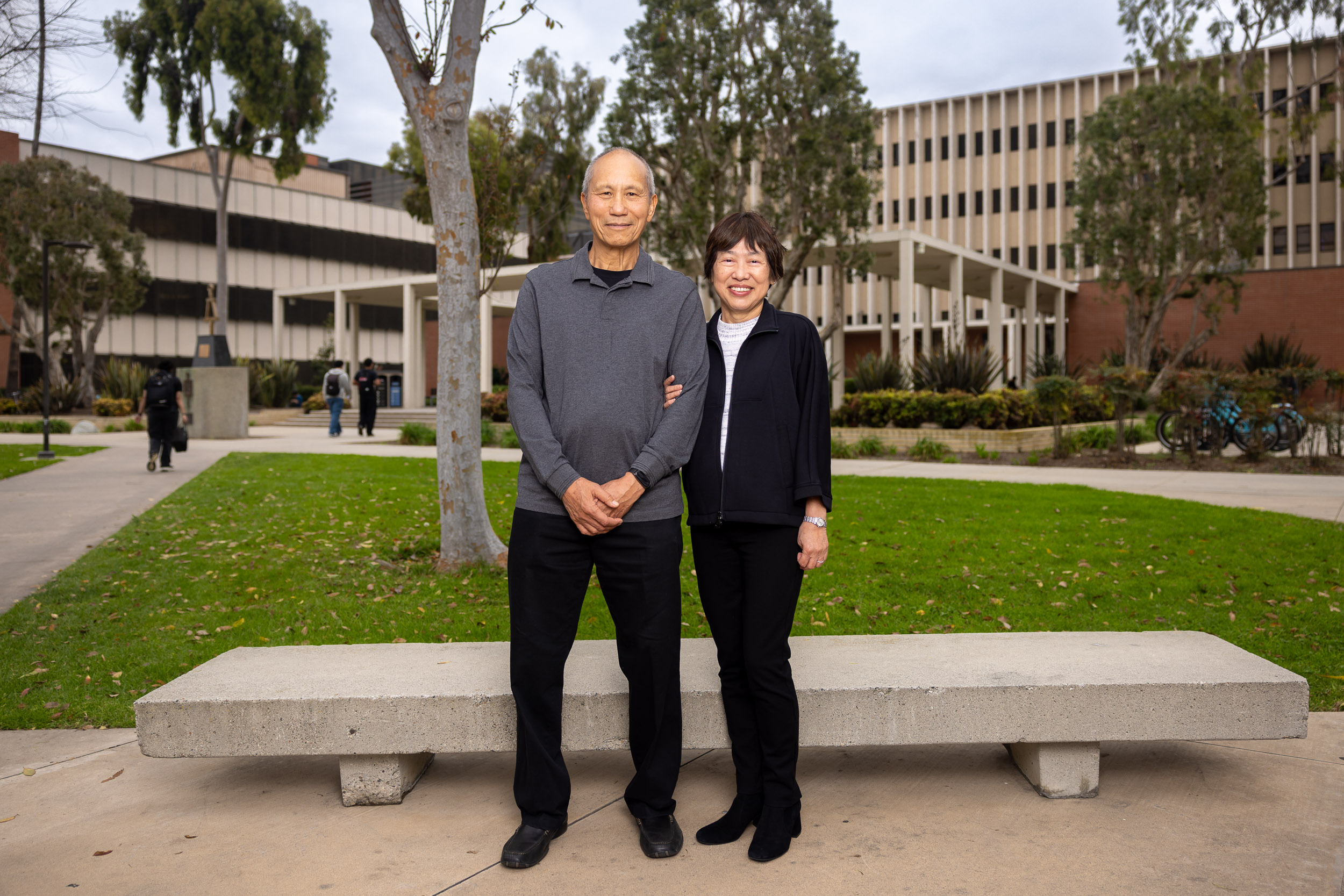 Couple stands in front of College of Engineering building
