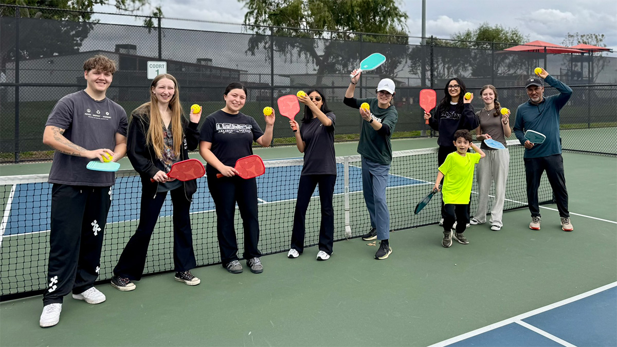 people posing in a serving position