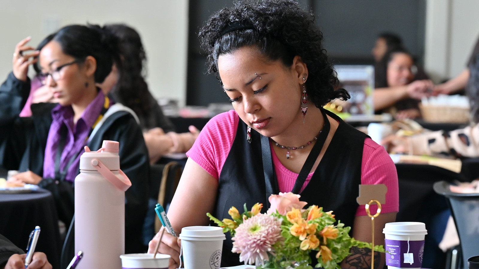 Female attendee at the 2025 Womxn of Color Leadership Conference.