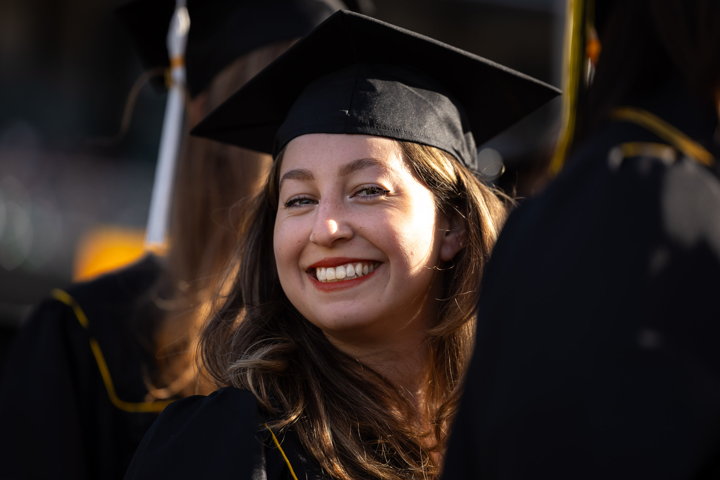 A close-up of a smiling CSULB graduate