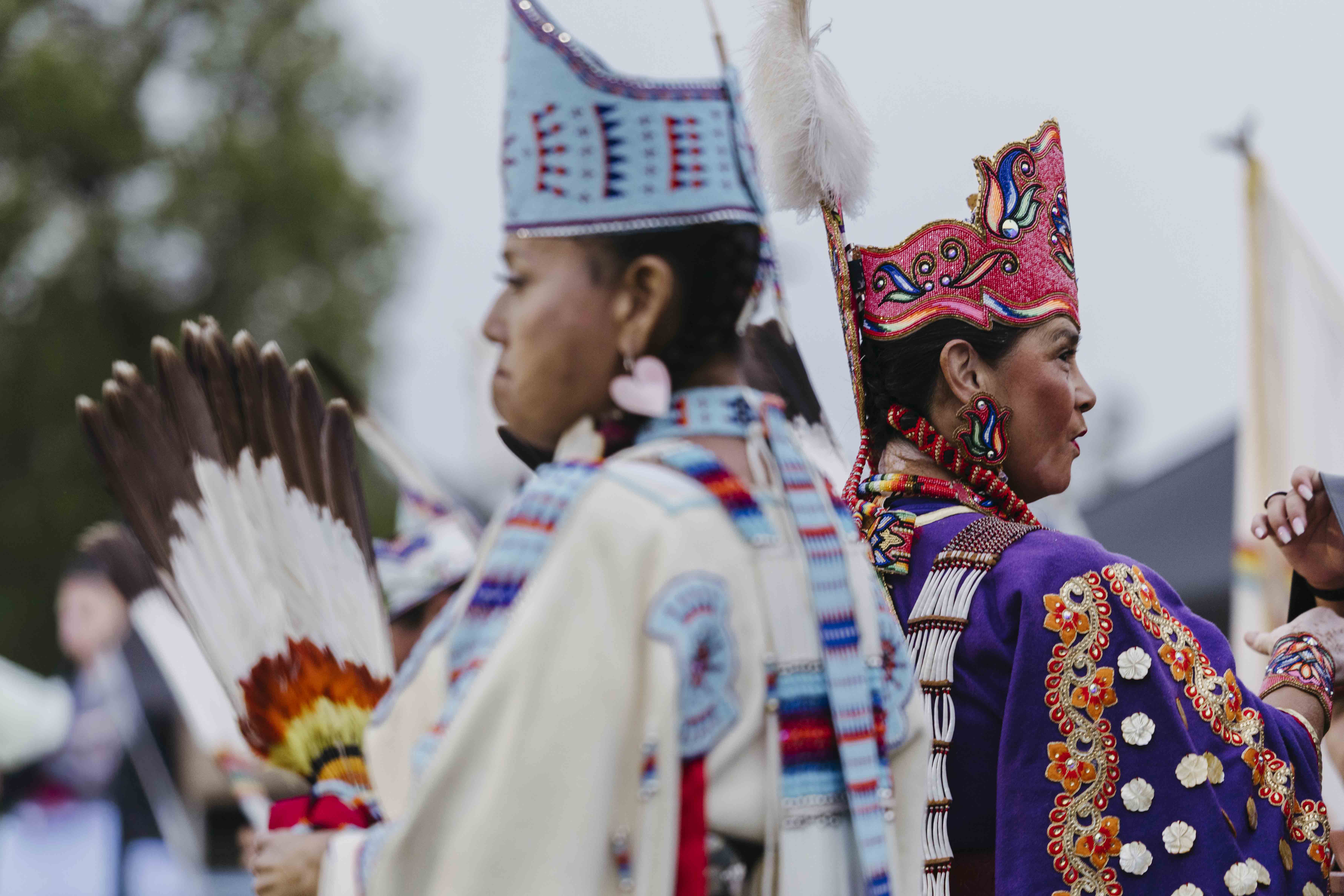 Two women wearing regalia at the 2026 CSULB Pow Wow