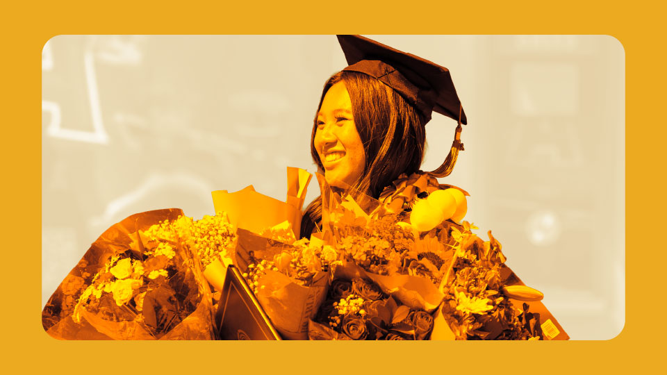 Commencement student with flowers