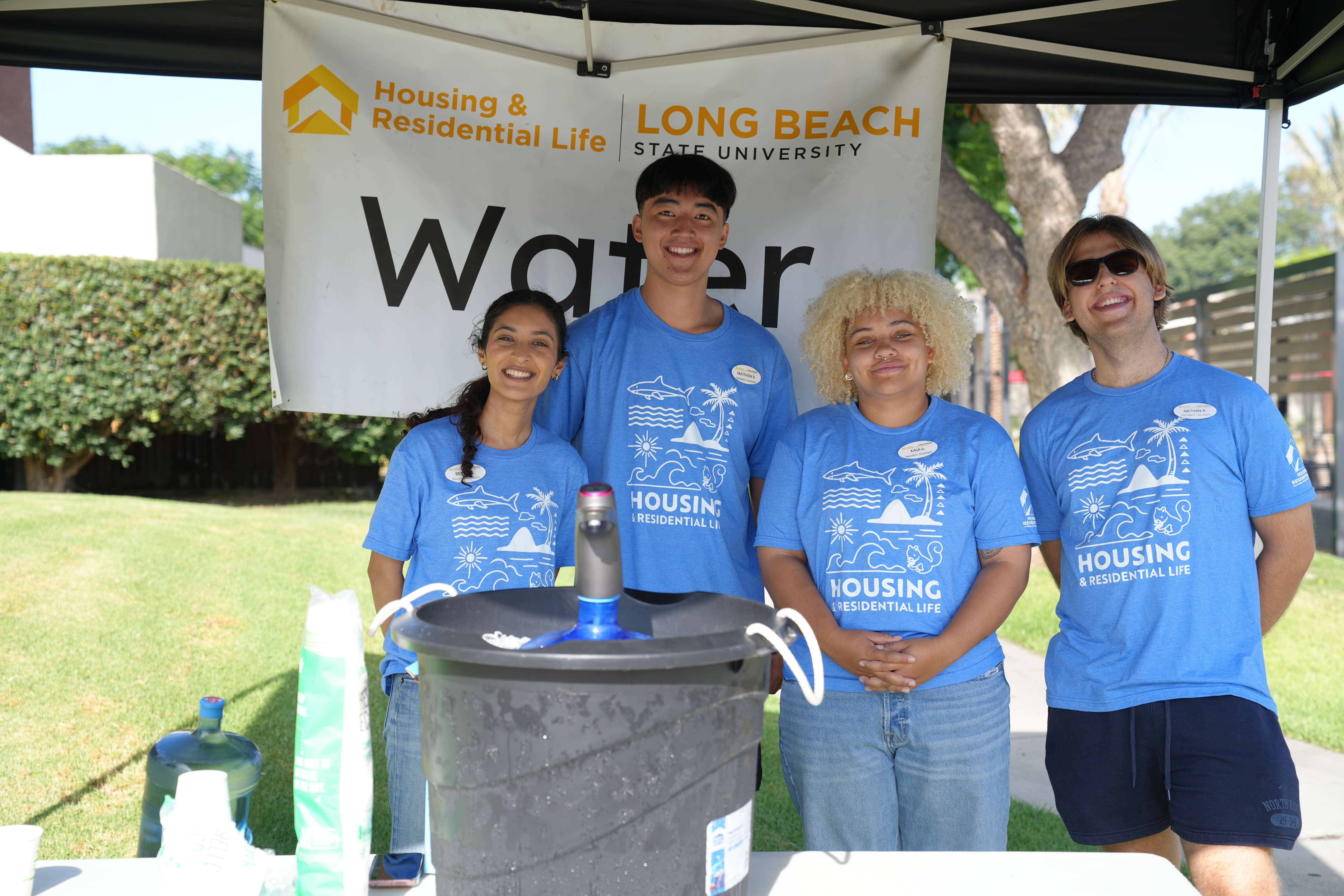 Housing staff providing water on move-in day.