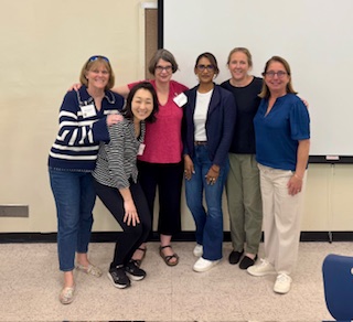 Professor Sanderson posing for a photo with California Inclusive College Alliance