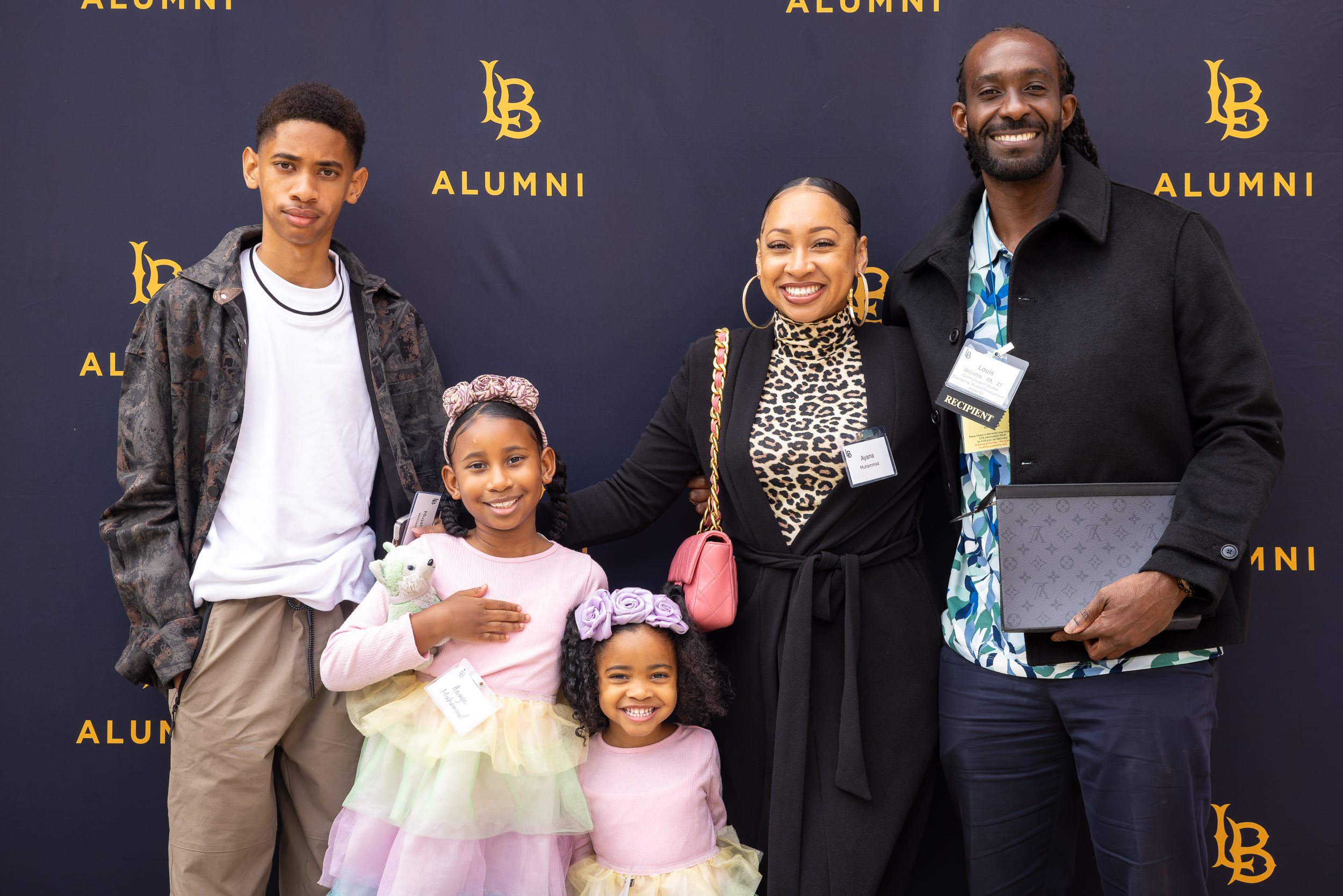 Group picture with Louis Williams '09, '21 at right