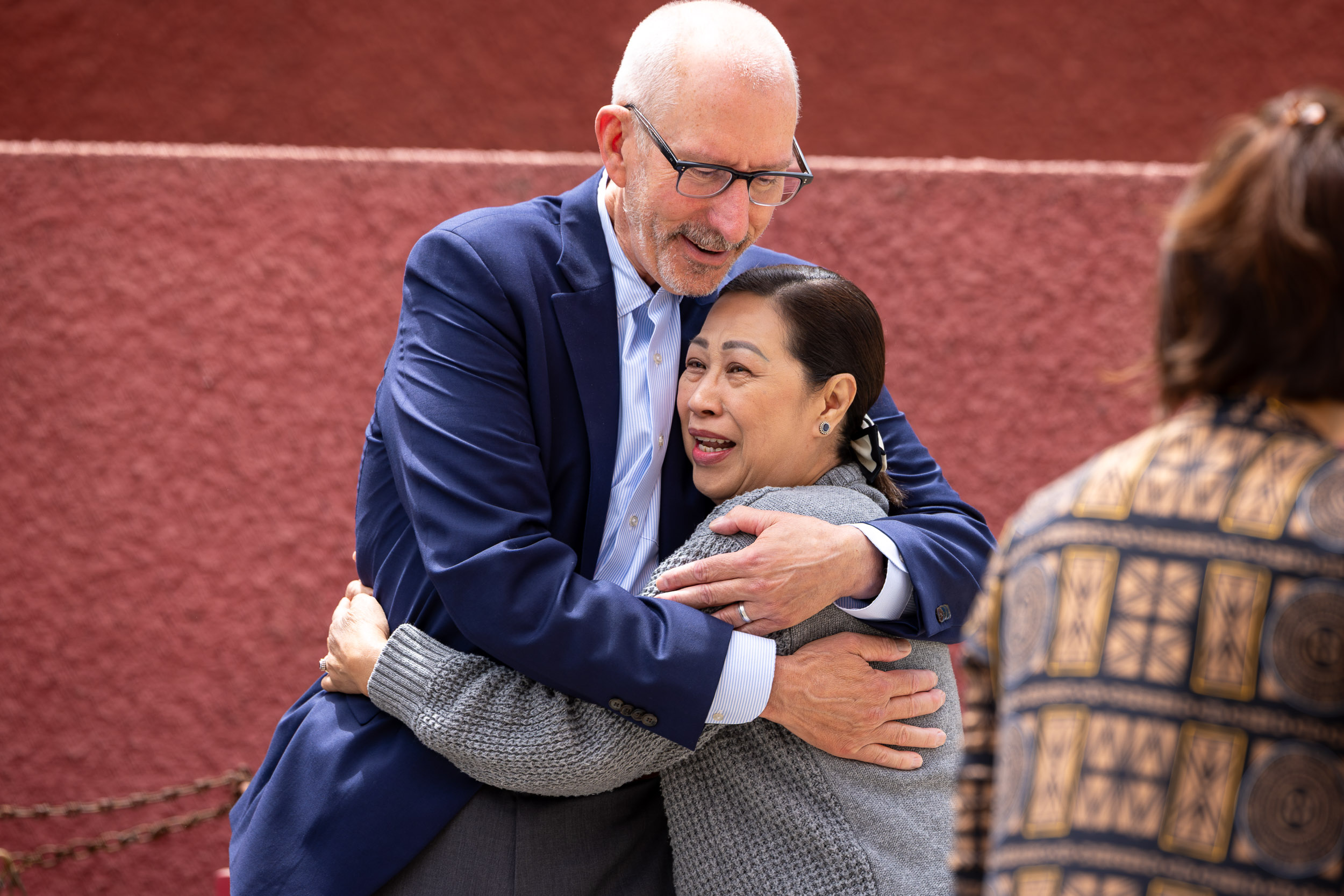 President David Andrews '82 embracing another person