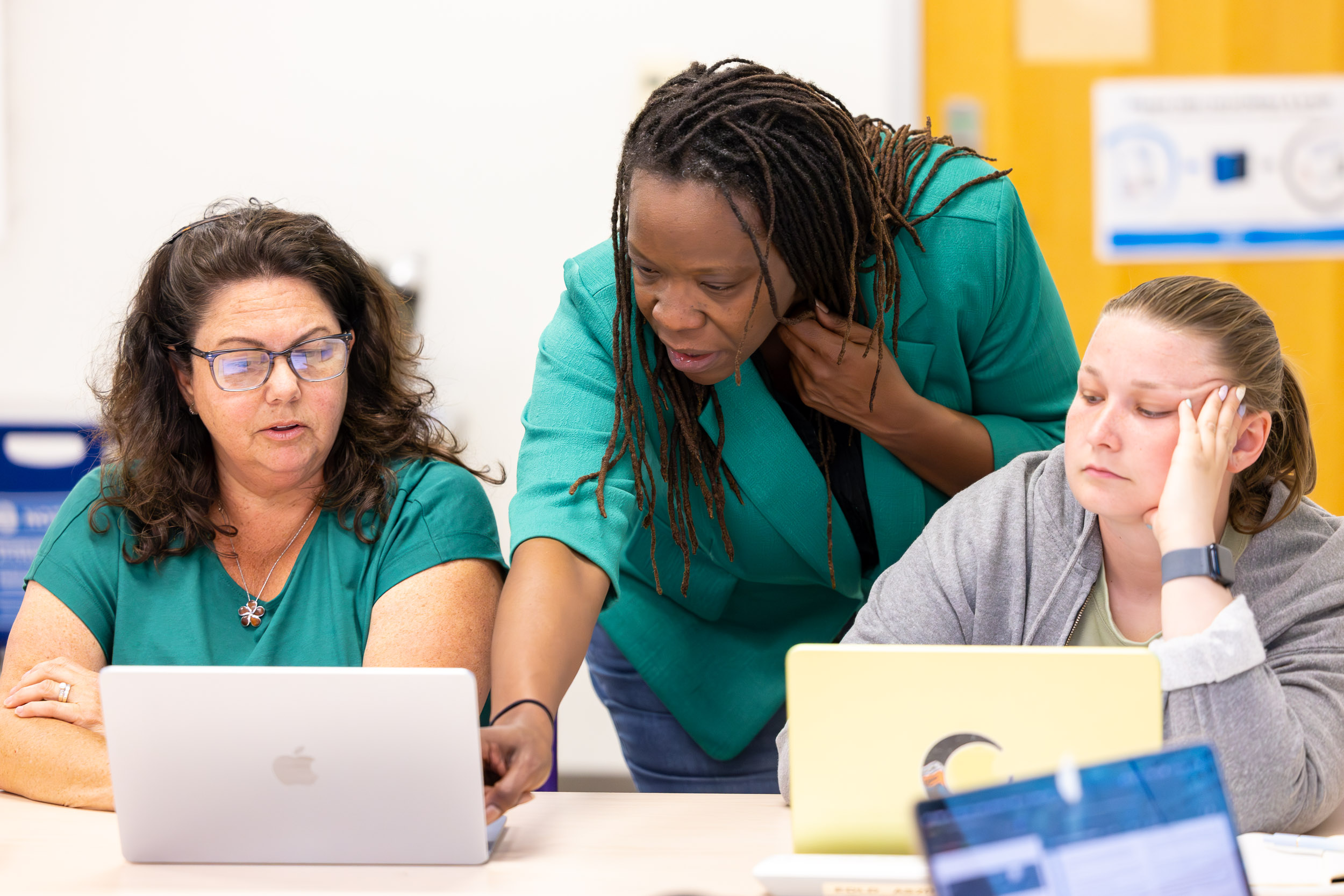 Jolan Smith, center, teaches a special education class at CSULB