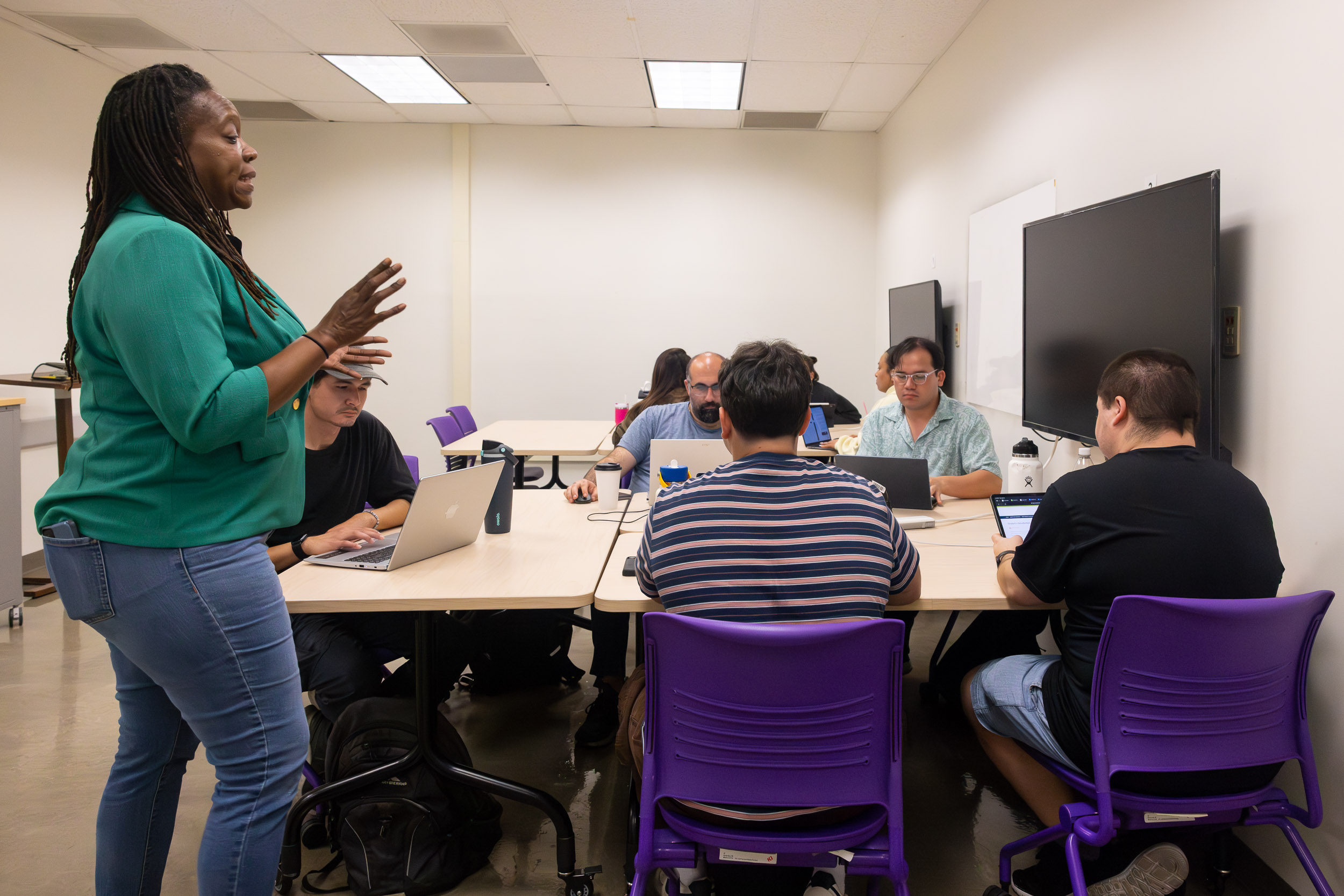 Jolan Smith, left, teaches a special education instruction class at CSULB