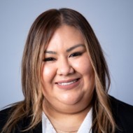 Noemi Guevara in front of gray backdrop