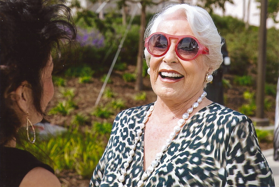 Regena Cole smiling and wearing sunglasses