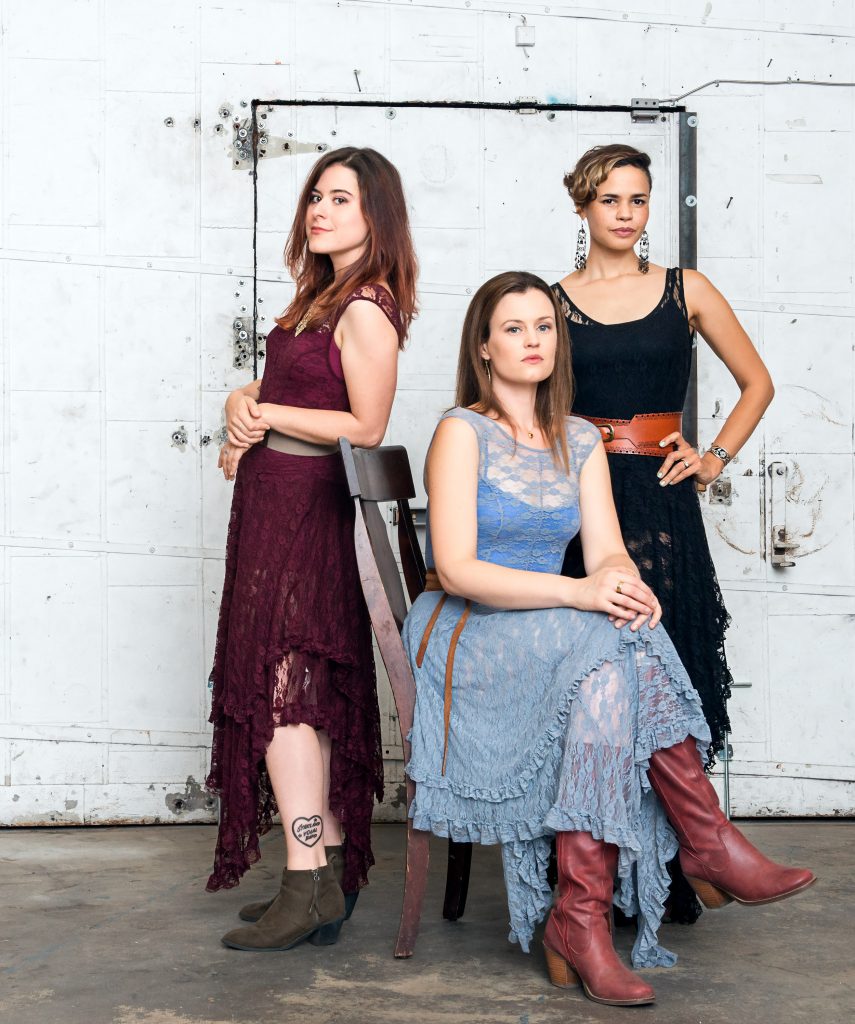 Anna Louise, Courtney and Christina make up the acapella group, Honey Whiskey Trio.