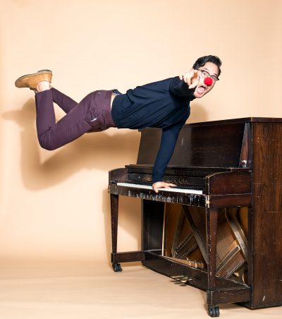 Actor Raymond Lee leaps on piano