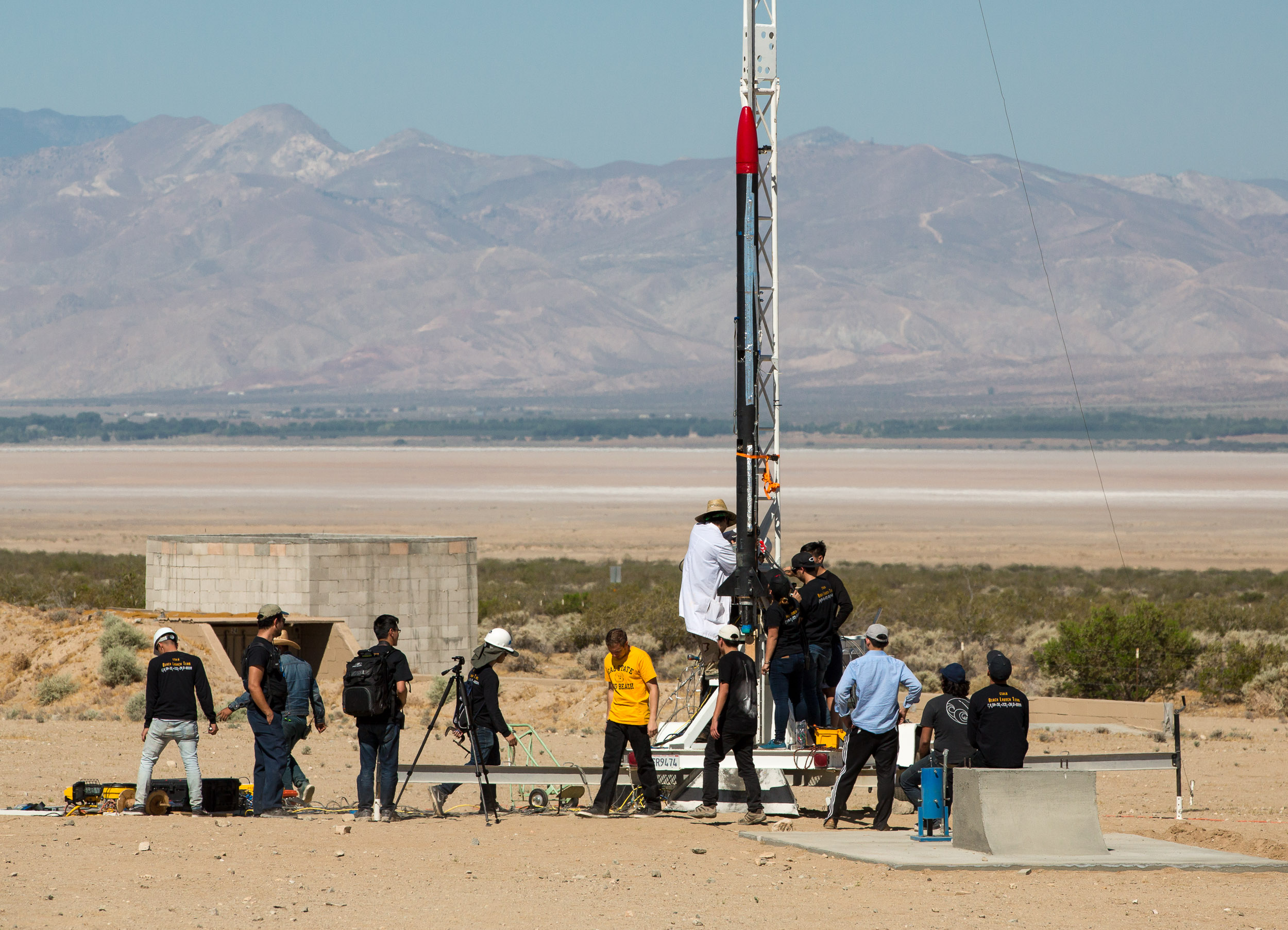Students, who are part of the Beach Launch team, attempt to launch an 18-foot rocket in the Mojave desert. Not all attempts are successful.