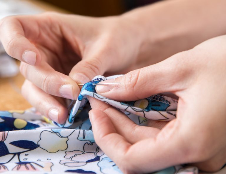 Sara Norrman sewing with a needle