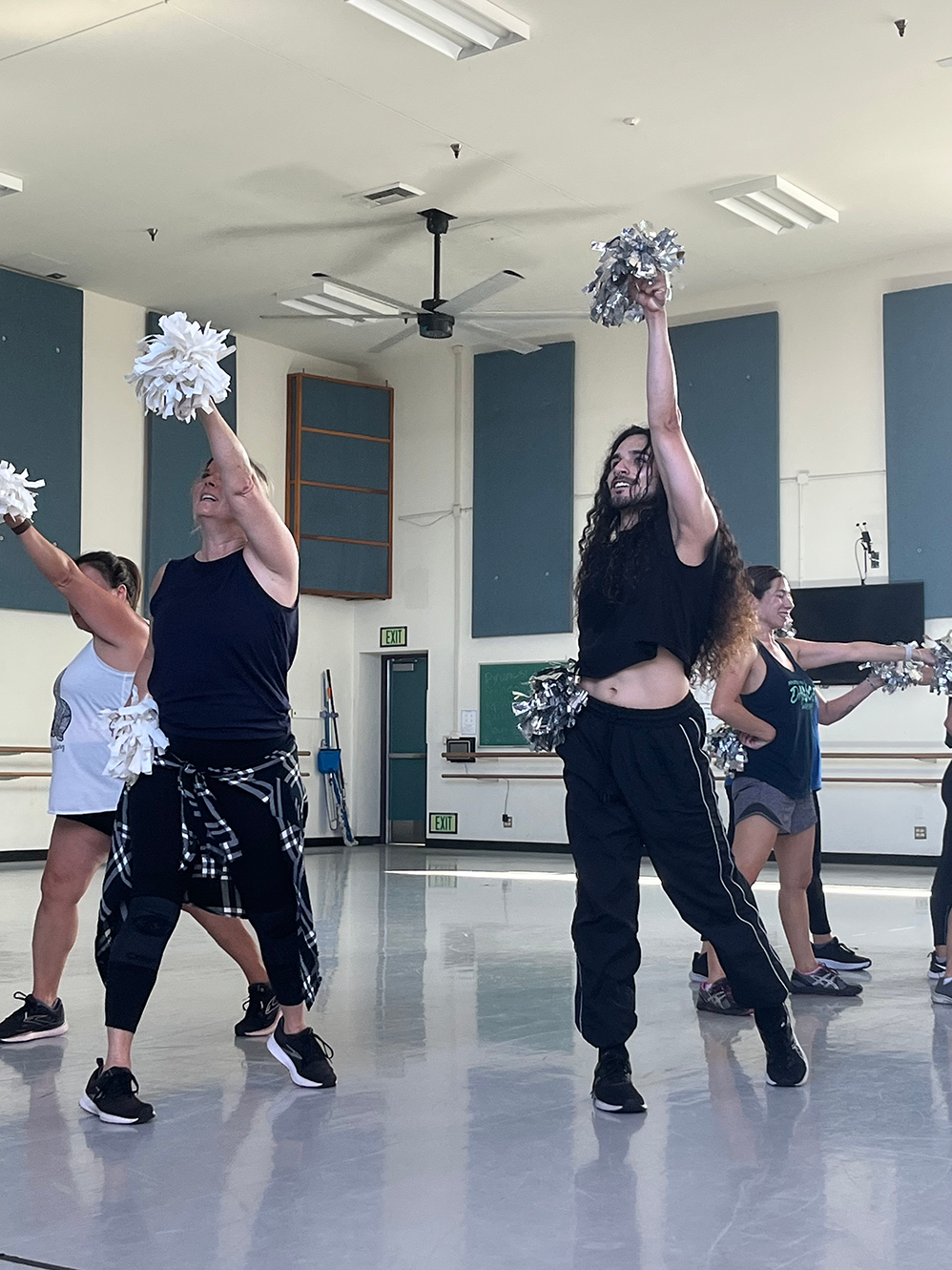 Dancers perform in a dance studio