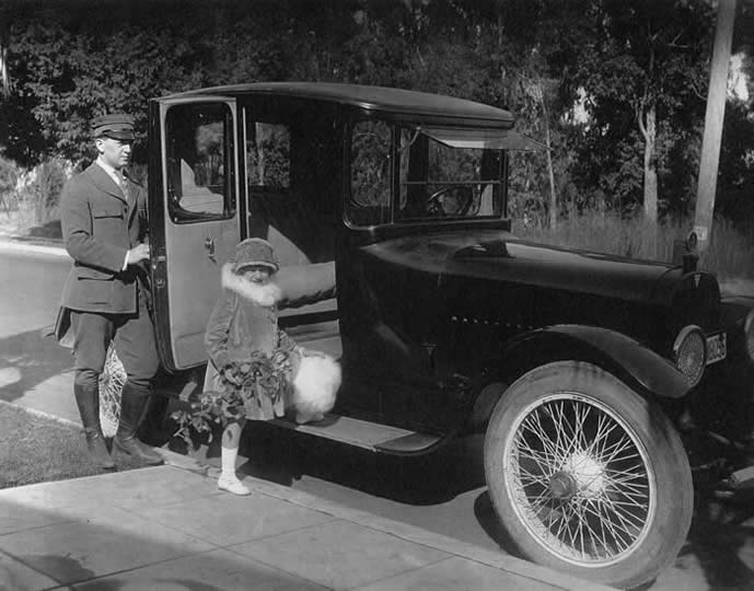 Baby Marie Getting into Her Parents' Car