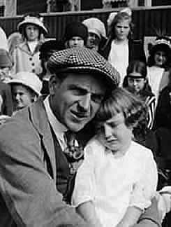 Henry King With Baby Marie on His Lap