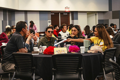 Attendees at a table socializing.