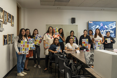 Attendees with giant loteria cards.