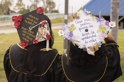 Latine themed graduation caps.