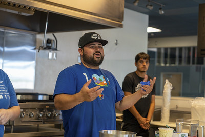 Taco maker presenting at Taco Tuesday.