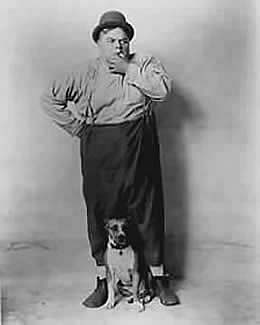 Roscoe Arbuckle and his Dog in Front of Blank Wall