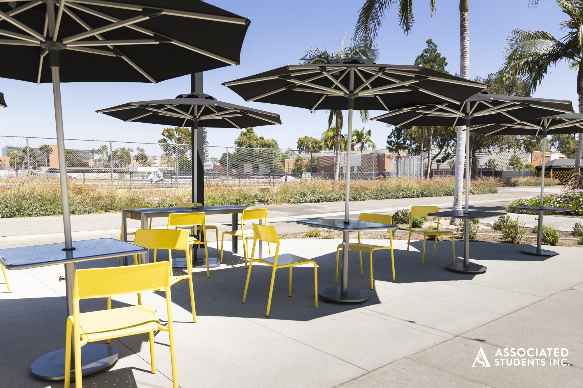 Tables in the area around Coastal Coffee to enjoy your drink and snack. 