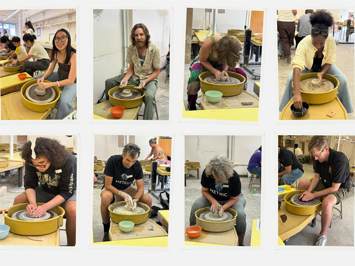 scholars and faculty at the pottery wheel