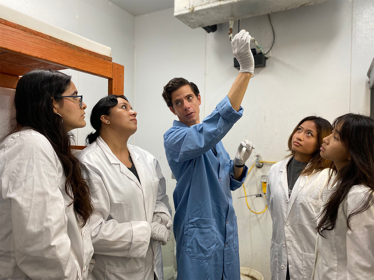Dr. Michael Carlson and student researchers in the lab