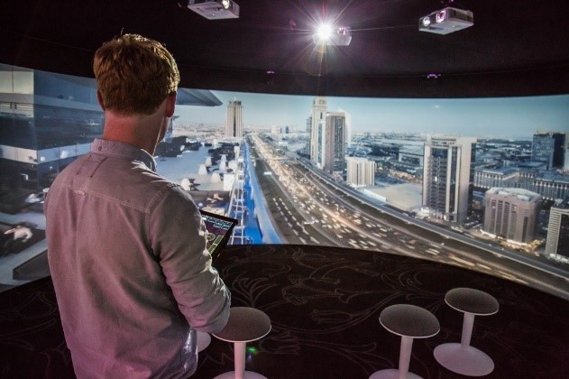 person viewing nighttime street in a 360 degree theater