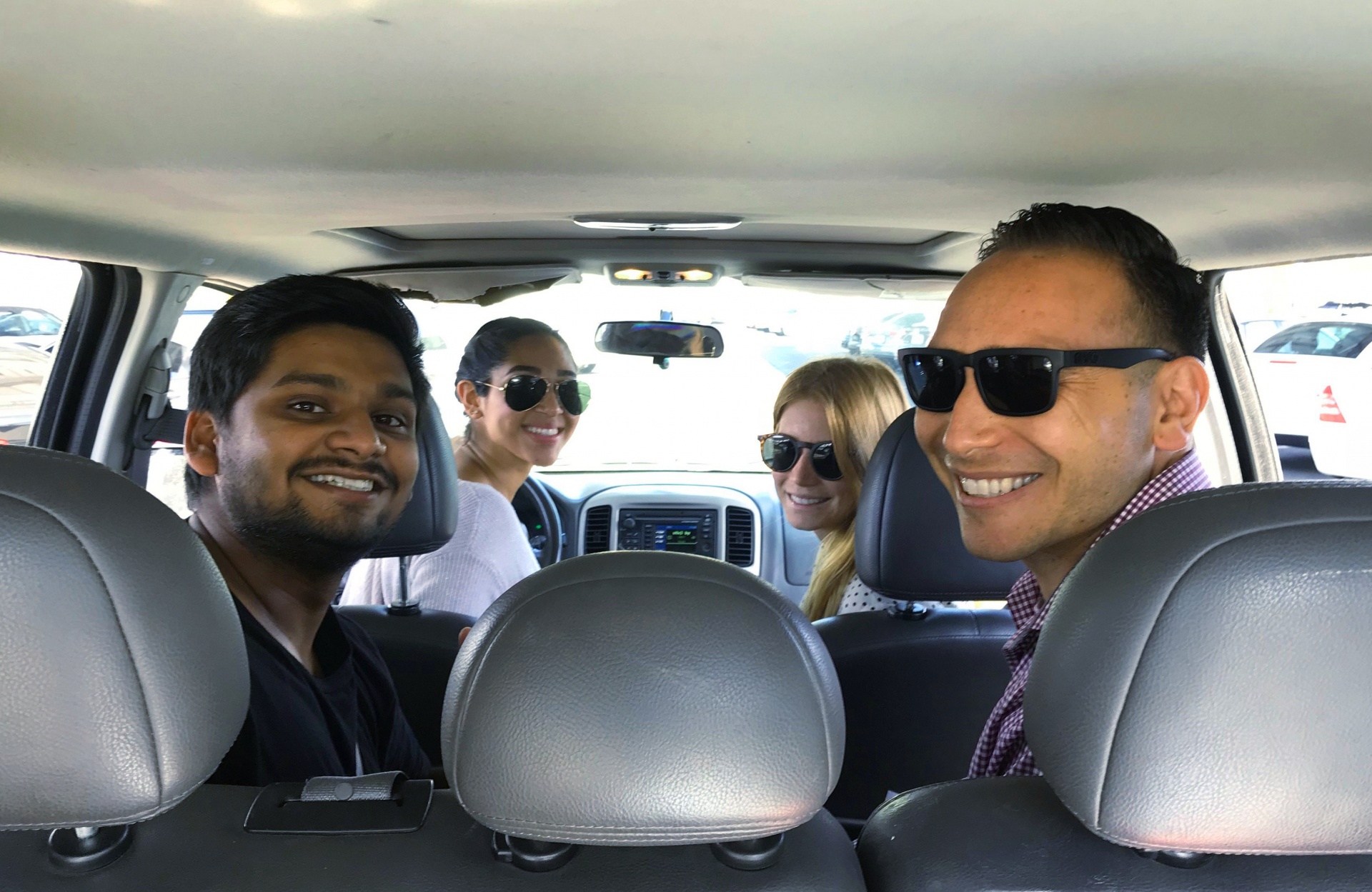 Four people inside a Zipcar