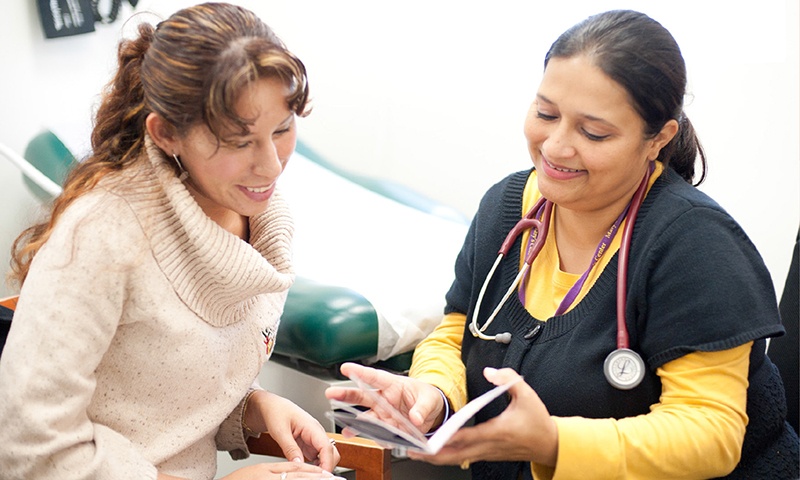 woman talking to a doctor or nurse