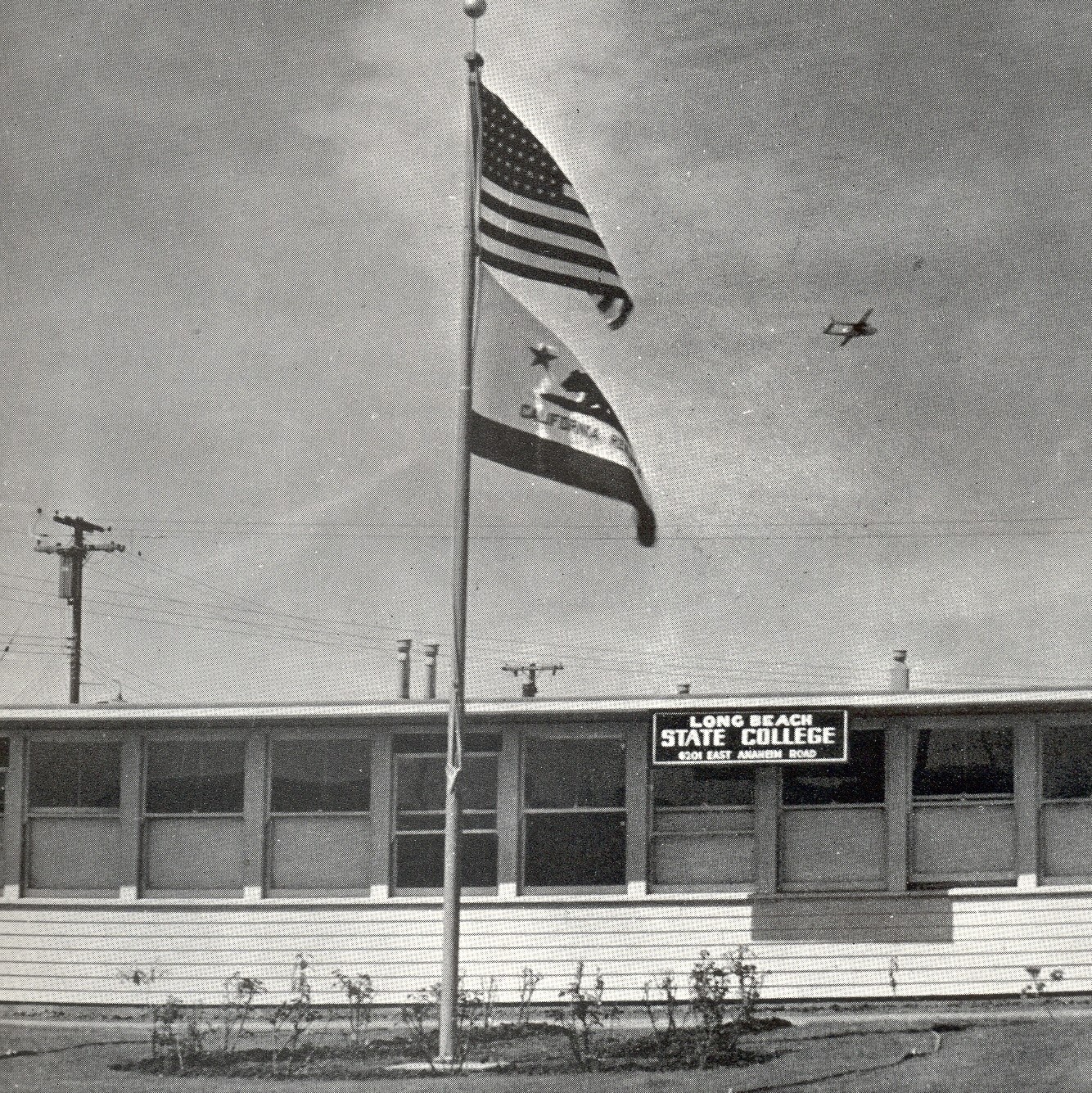 9.28_8am_social_media_2_square.jpg flags fly over original long beach state college building