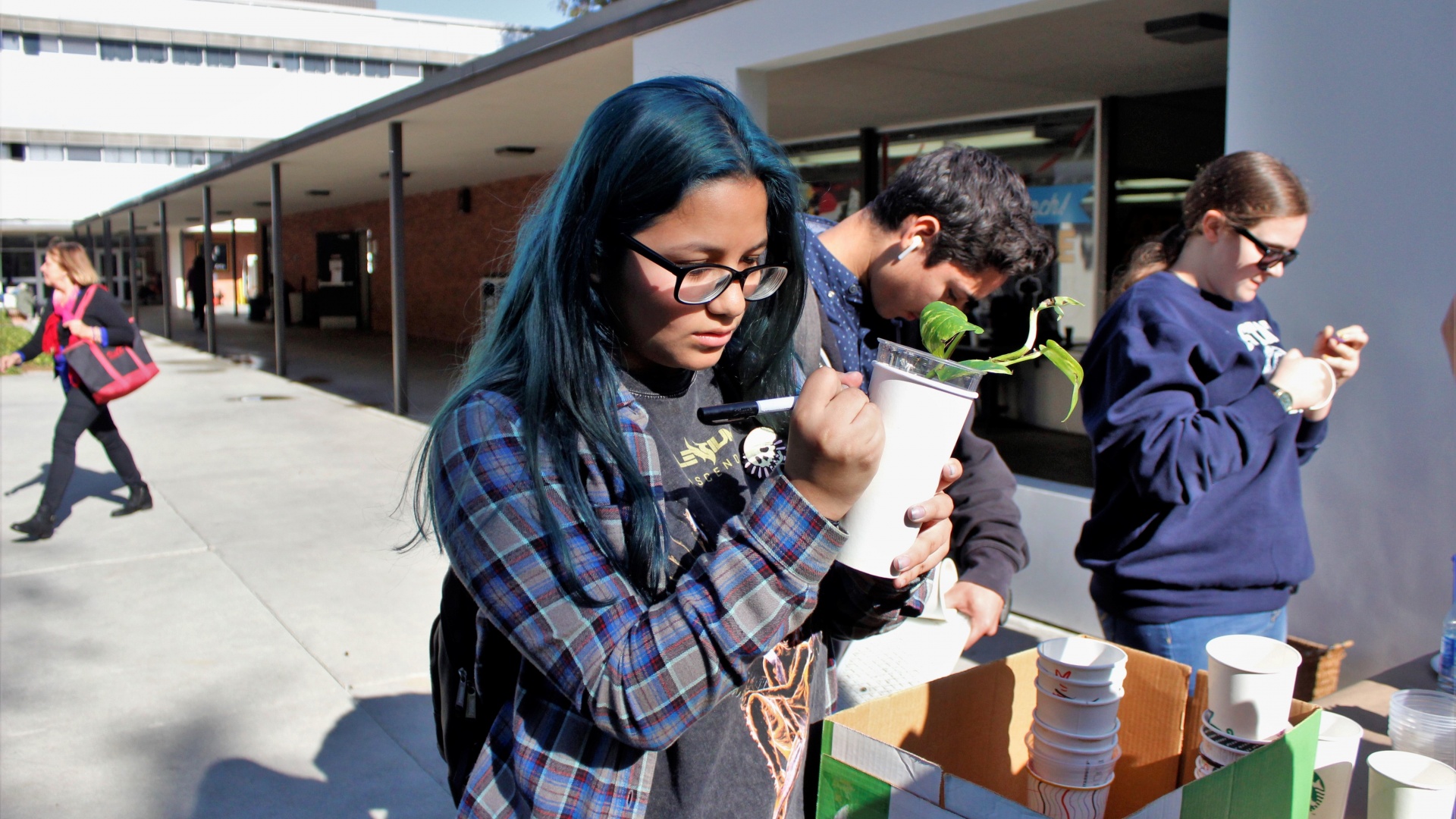 girl decorating cup