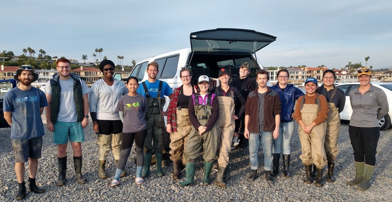 A tired and muddy field crew