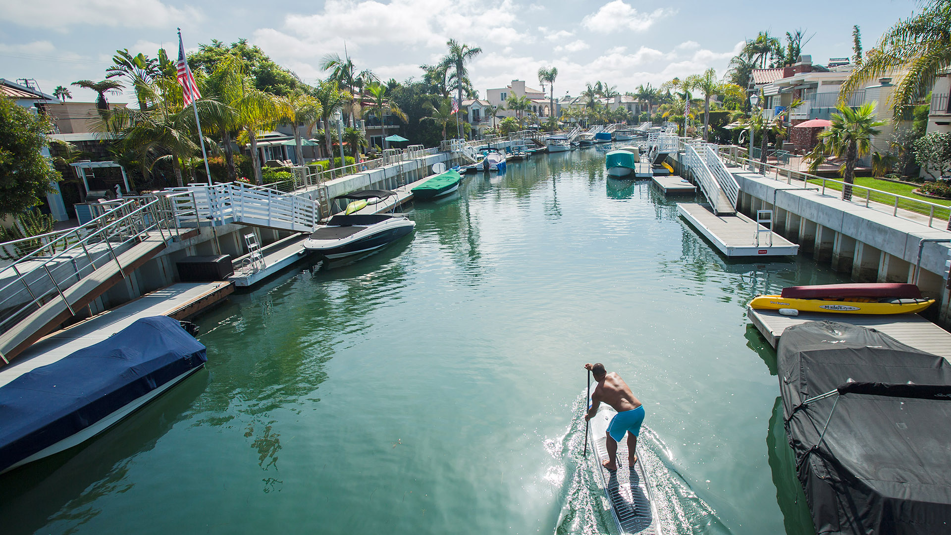 Paddleboarder heads down canal