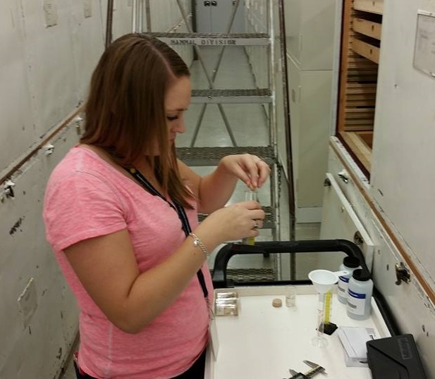 Ashly Romero measures small skulls in a museum