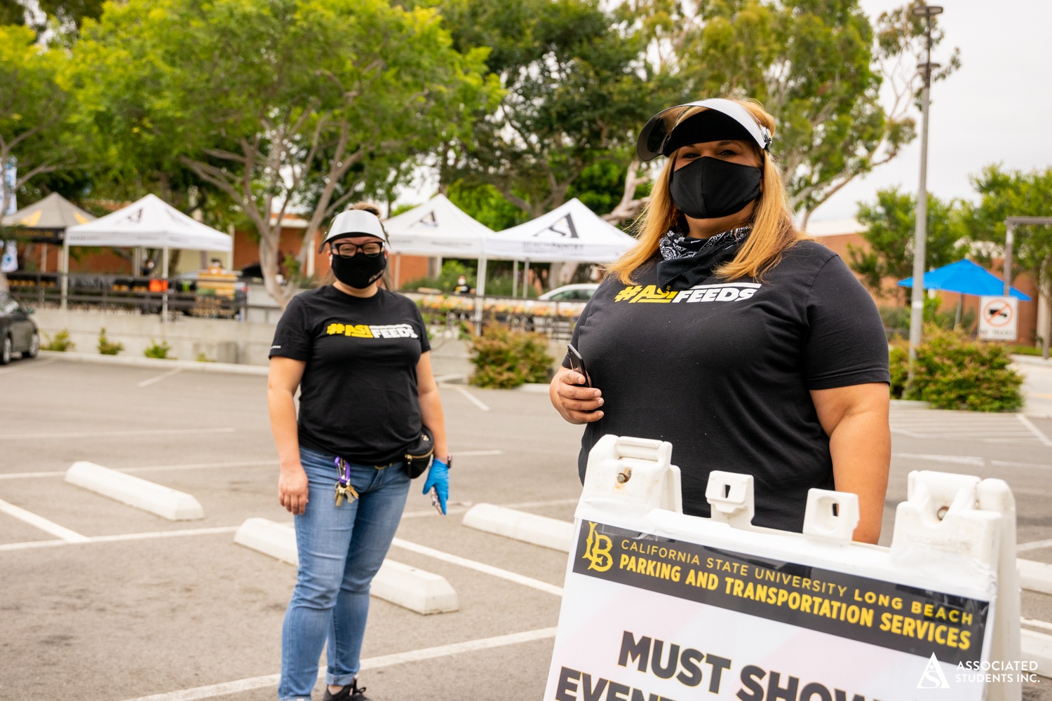 asi workers at food giveaway