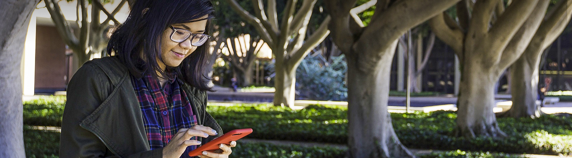 Student on campus with phone