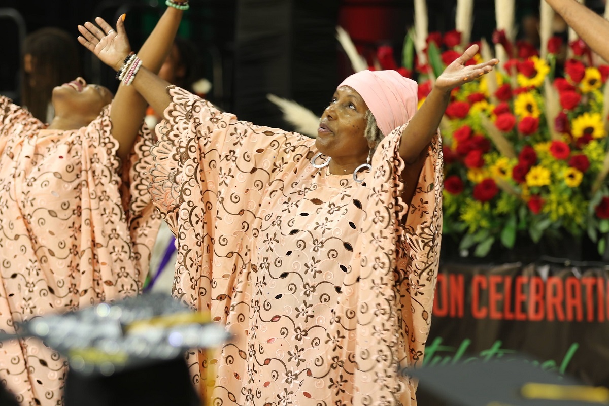 Graduates dance at the 2022 Black and Pan African Commenceme