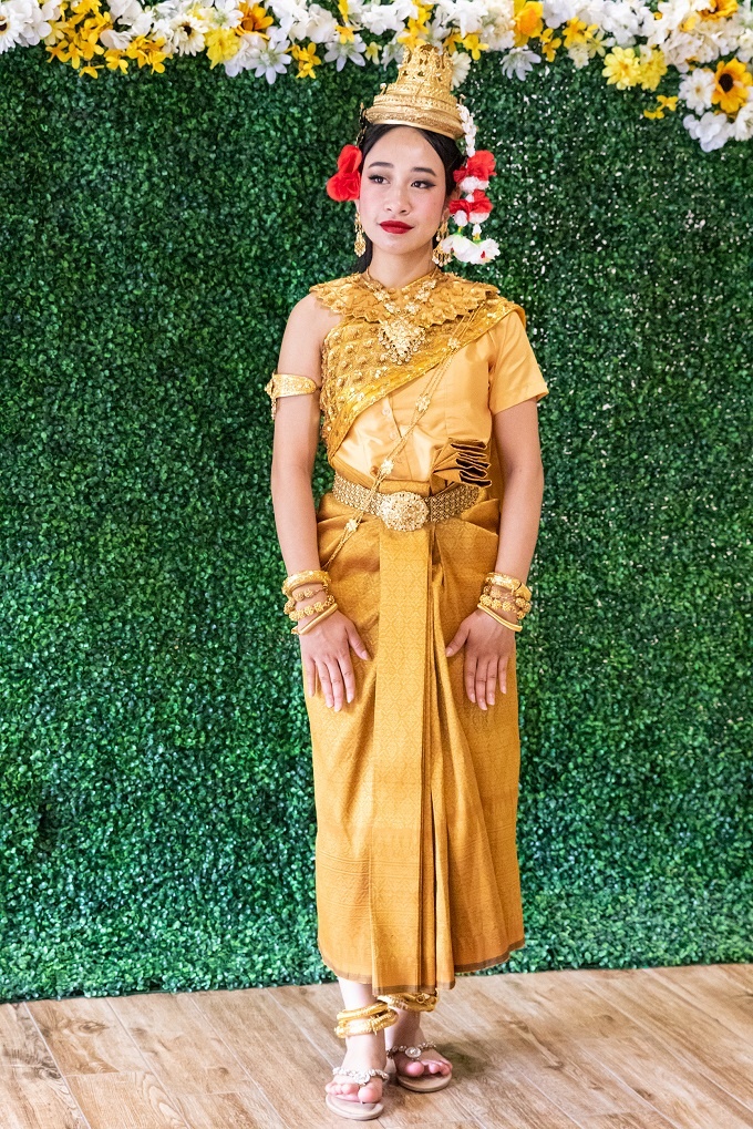 A woman in regalia poses at the 2022 Cambodian Cultural Cele