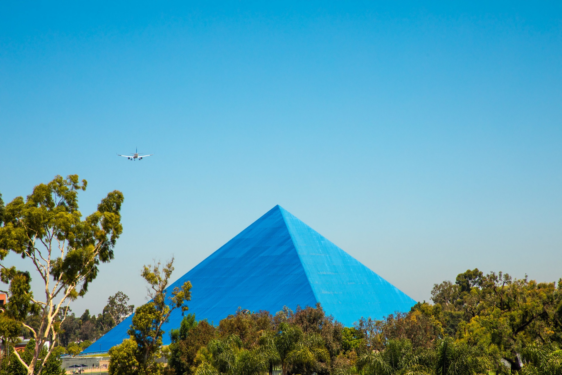 Campus pyramid with airplane overhead